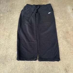 Y2K baggy black Nike sweatpants with distressing and fading
